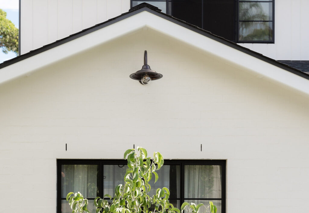 Light mounted on the exterior wall of house.