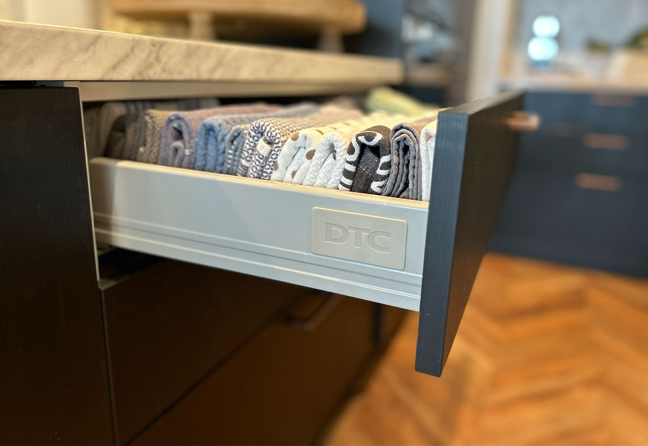 kaboodle kitchen drawer filled with tea towels.