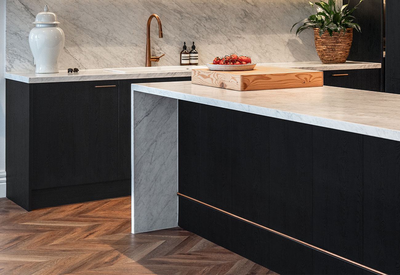 Beaumont hybrid flooring in a black kitchen.