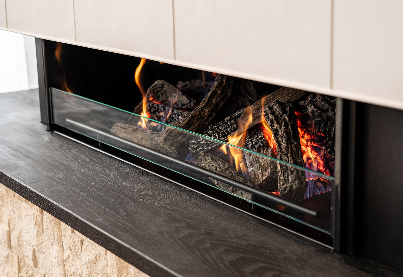 Horizontal built-in fireplace in a modern living room.