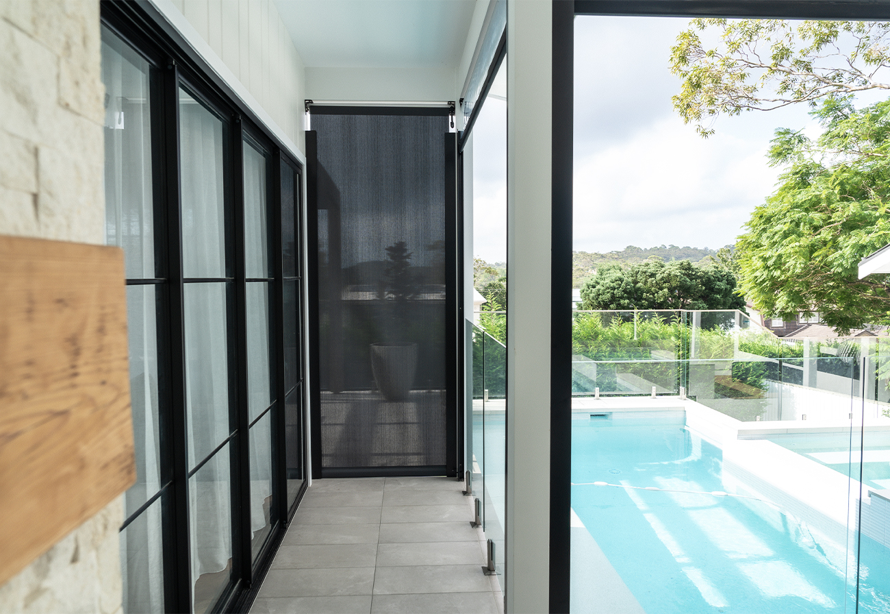 Outdoor blinds in a covered alfresco area.