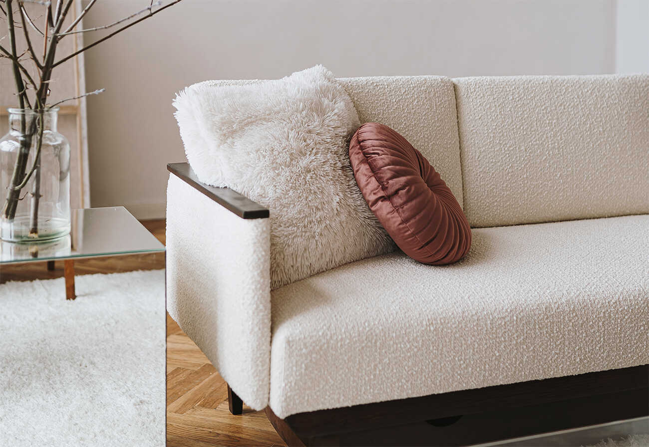 white sofa on a hardwood floor.