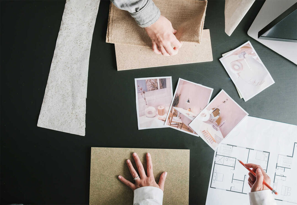 Interior designers handling swatches at a table.