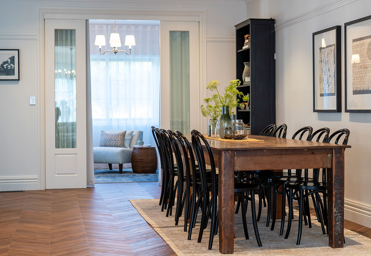 Double glass doors leading from a dining room to a study.