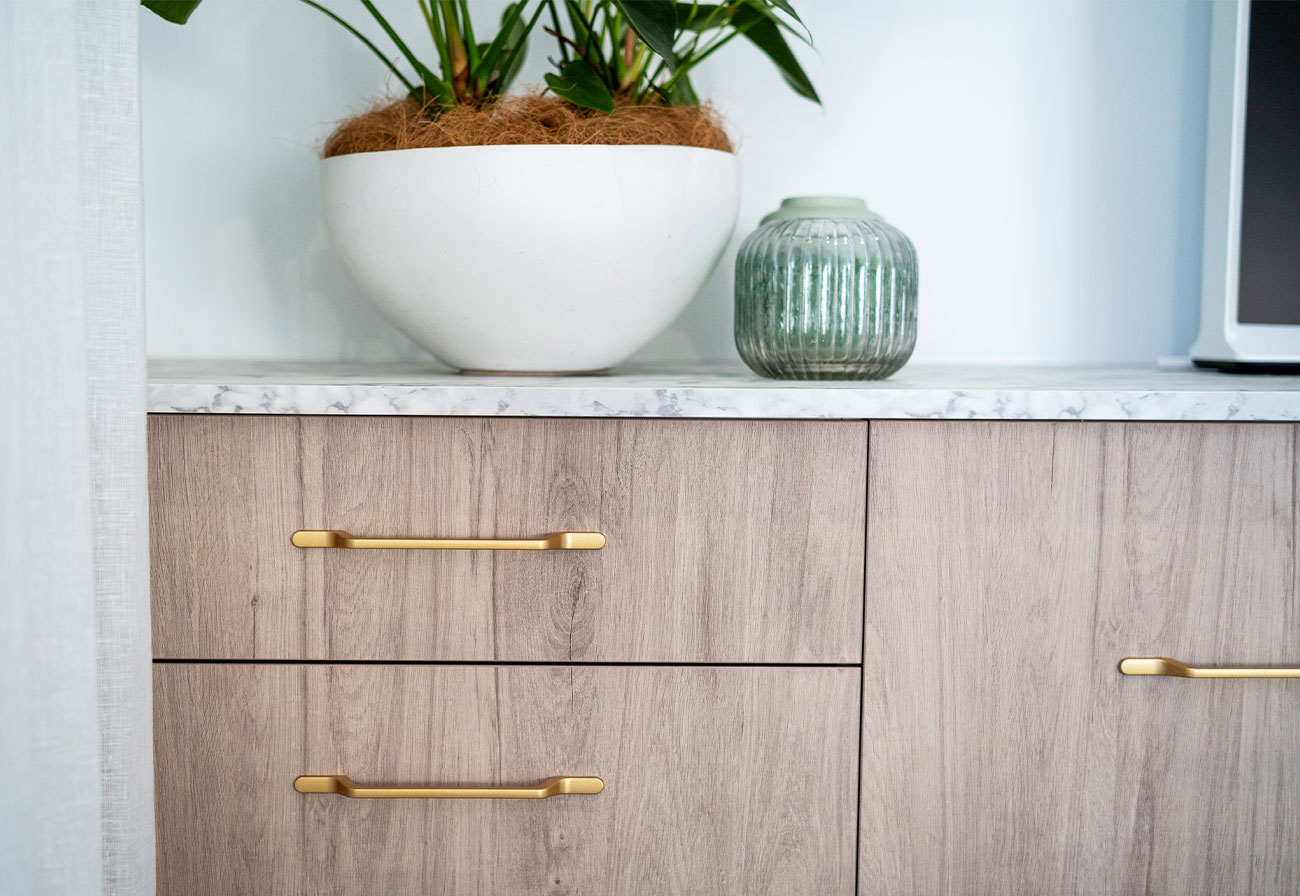 Gold salento handles on a kaboodle maplenut sideboard. 