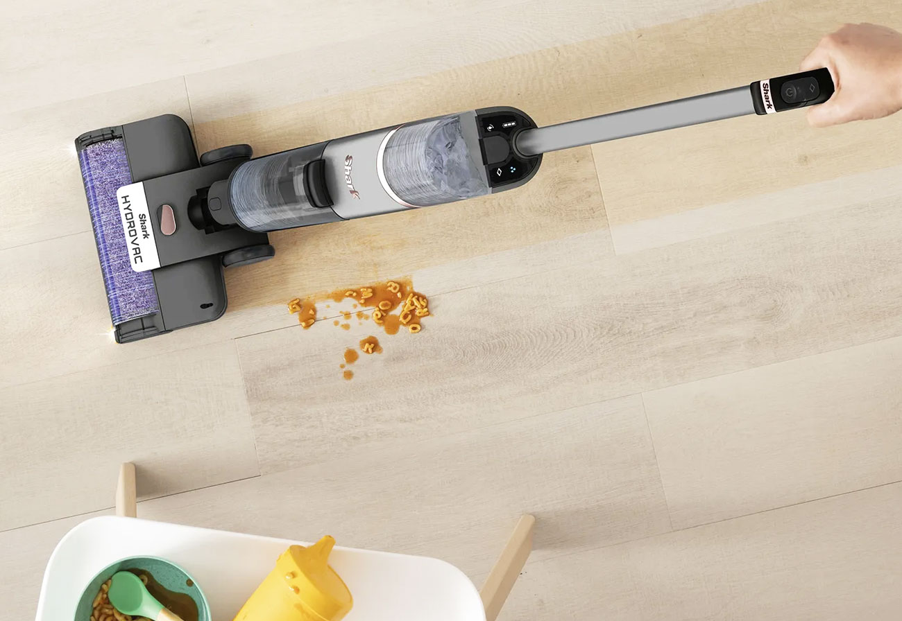 Vacuuming up child's spilt cereal on a laminate floor.