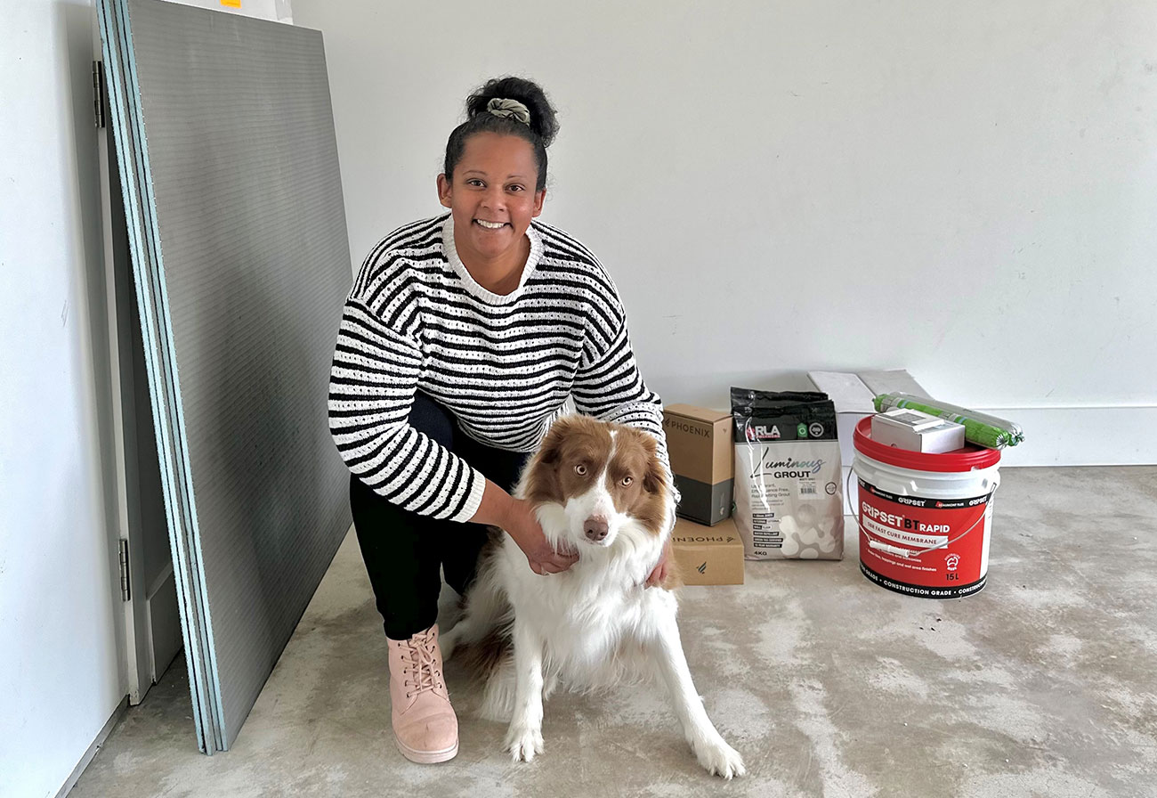 Cheryl Esser and her pet amidst renovations.