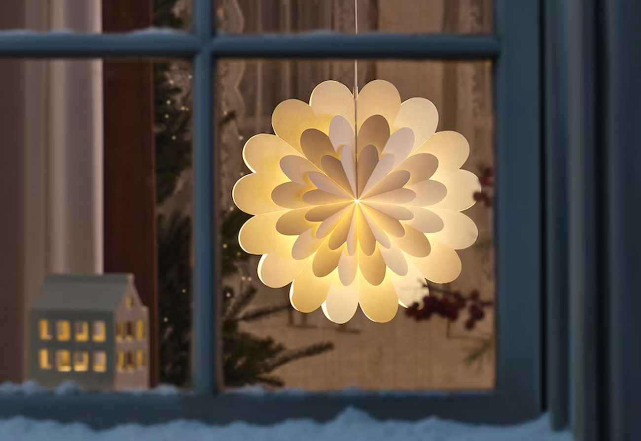 Strala lamp shade hanging in a window.