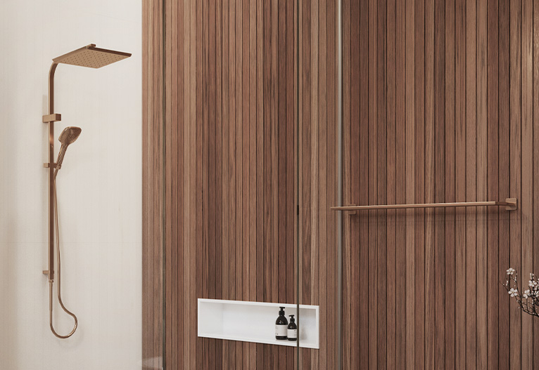 Brushed copper shower with wood-panel shower wall.