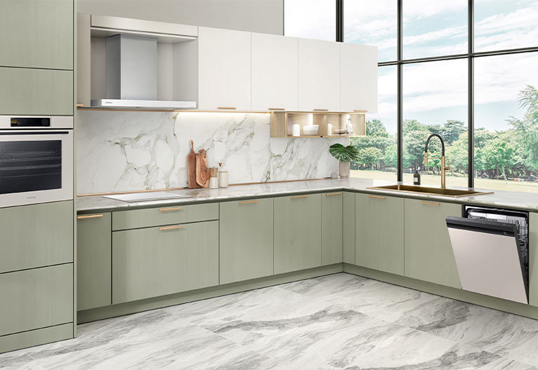 Bright kitchen with large windows and green cabinetry.