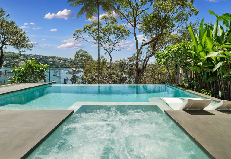 Swimming pool in Mosman with view of water.