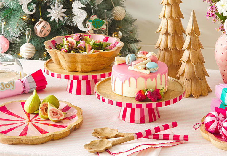 Candy-striped tableware on a Christmas table.