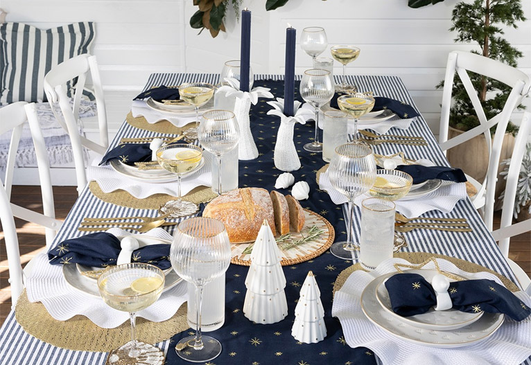 Christmas table decorated with navy runner.