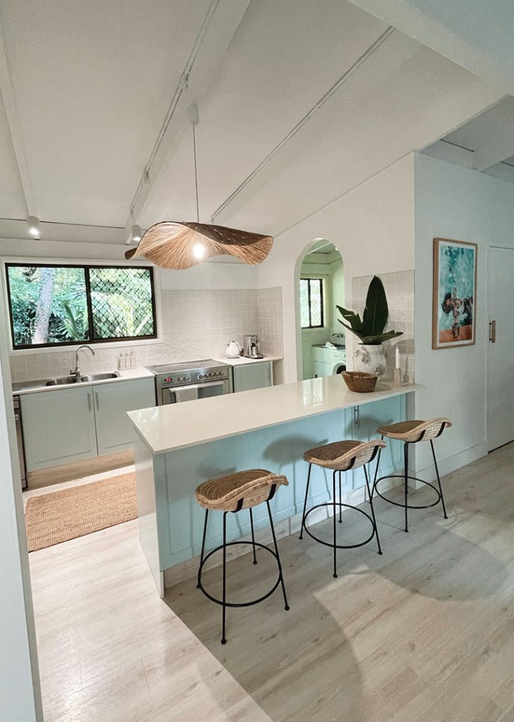 Coastal kitchen with blue feature bench.