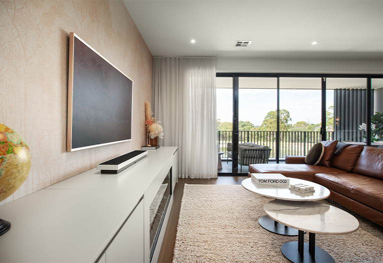 View of native trees from a living room.