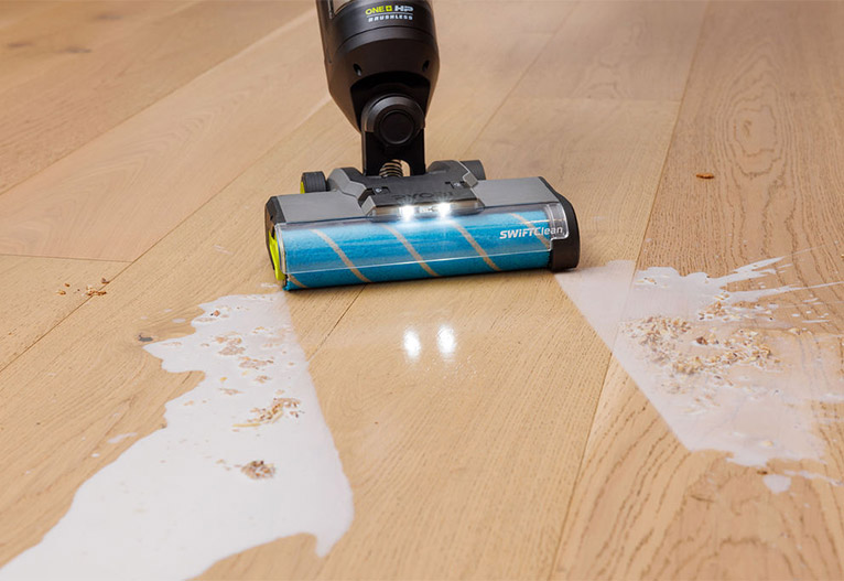 Vacuum cleans up spilled milk on hard floors.