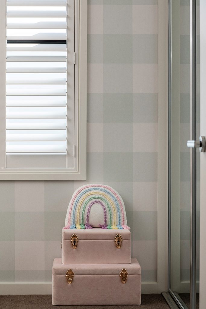 Grafico Gingham Check Sage Green wallpaper in a child's room.