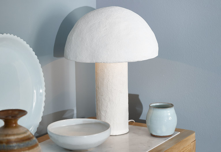 Mushroom shaped white lamp.