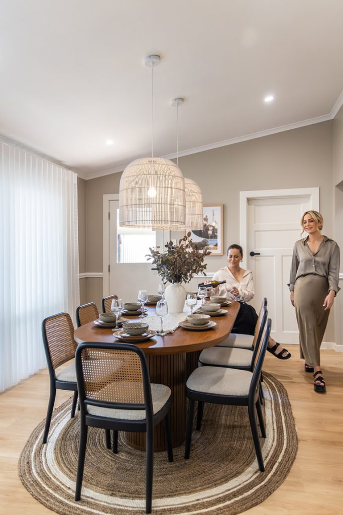 Alisa and Lysandra in a renovated dining room.