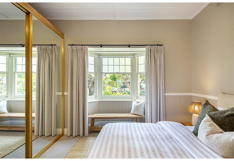 Master bedroom with bay window.