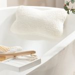Bamboo bath pillow stuck on the tub.