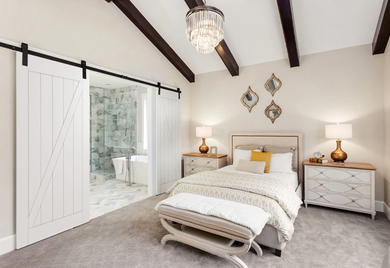 Frontier barn door in a country-style bedroom.