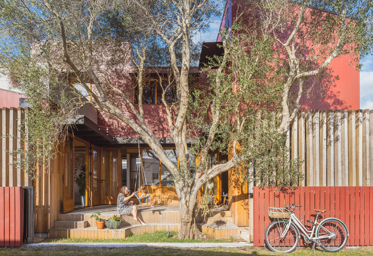 Sustainable red Olive Tree House in Stockton, NSW.
