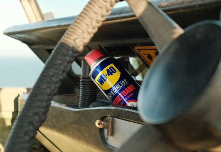 A can of WD-40 in the glove box of a truck.
