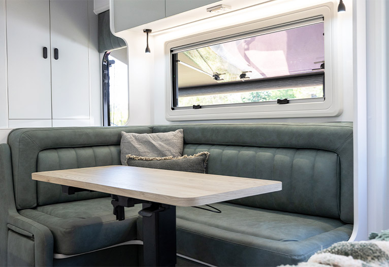 Curved seating inside a modern caravan.