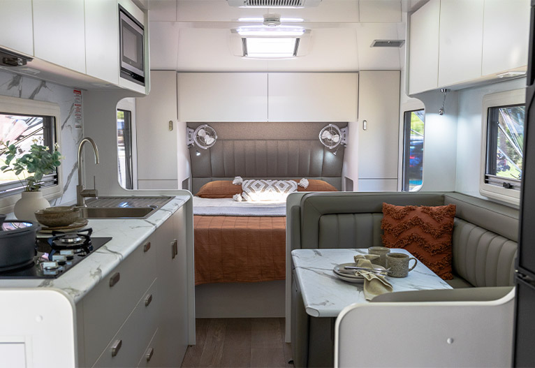 Modern caravan interior with nature-inspired colour scheme.
