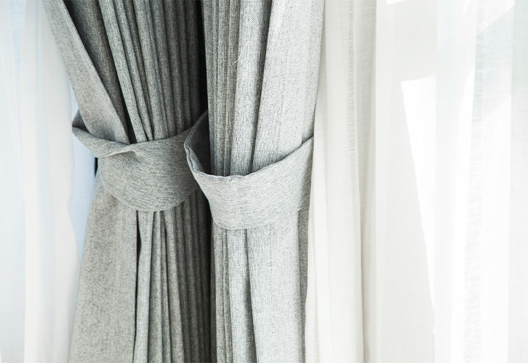 Linen curtains paired with white sheers.