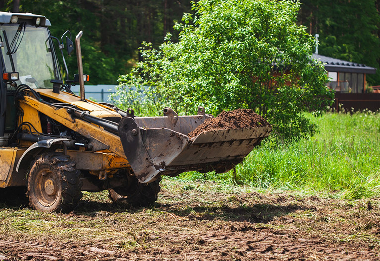 Bulldozer levelling a block of land.