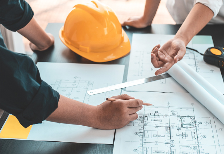 People looking at house plans.