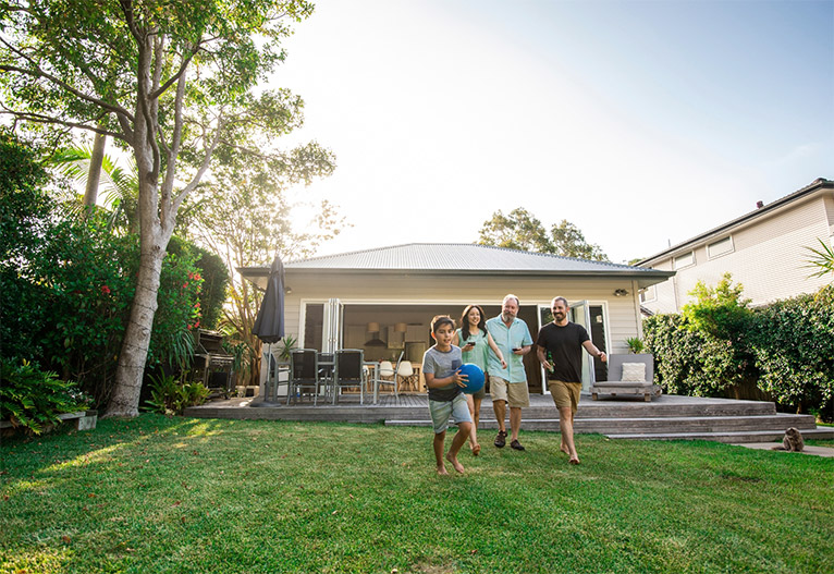 Backyard with large lawn area.
