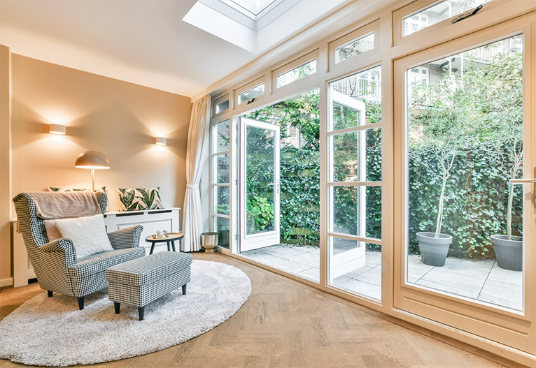 Well-lit room with a feature armchair.