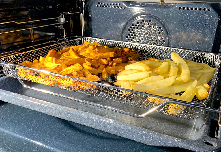 Kleenmaid Triple Combi Oven interior with chips cooking.
