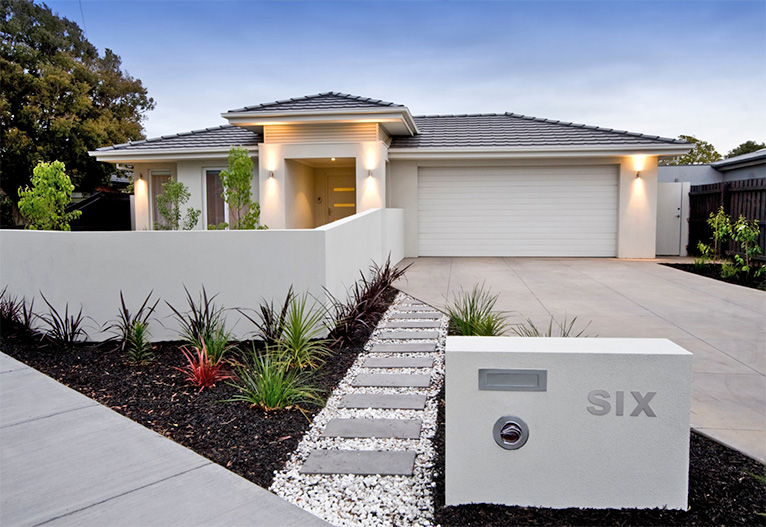 Modern home with landscaped facade.