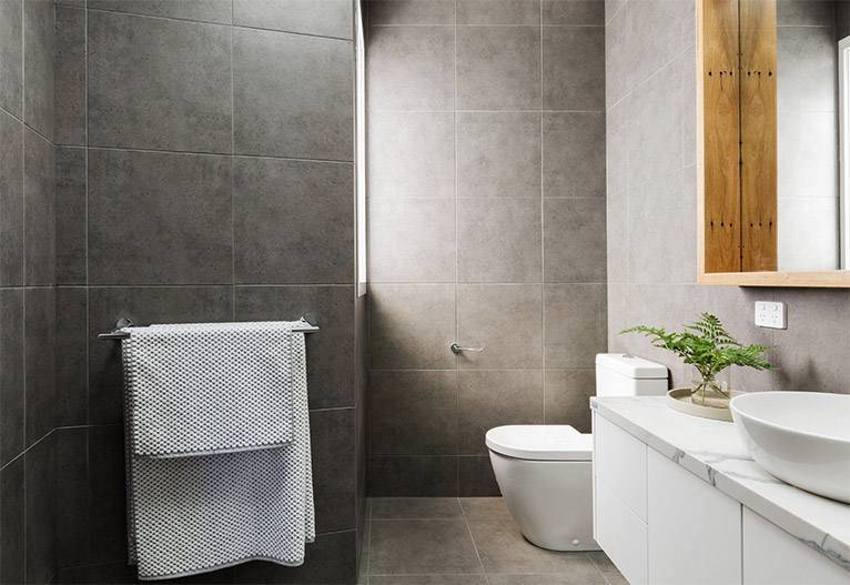 A renovated grey bathroom.