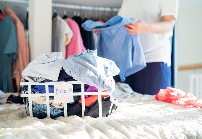 Person sorting out their wardrobe.