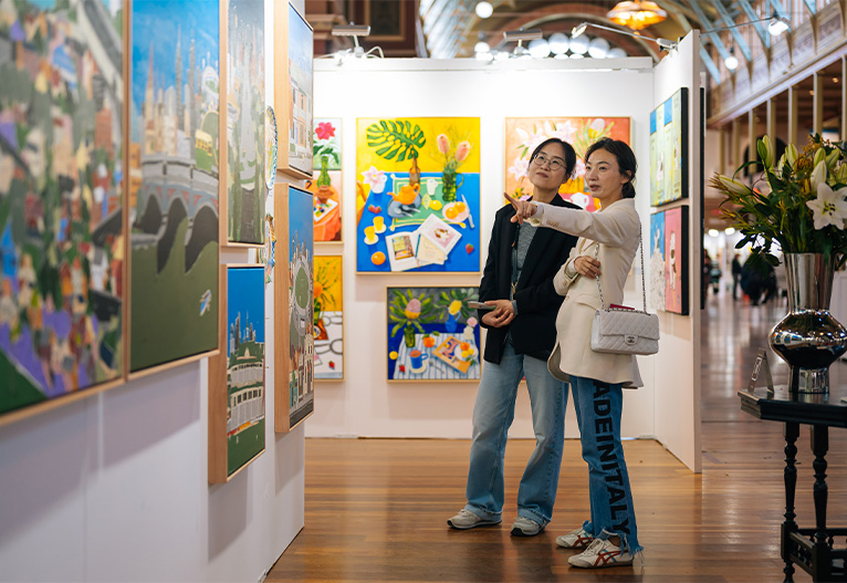 Women talking at the Affordable Art Fair Melbourne.