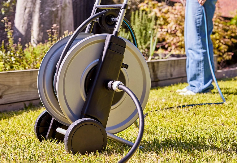 Nylex metal hose reel on grass.