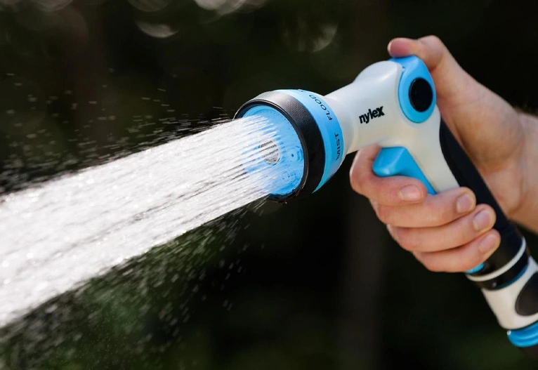 Person holding the Nylex Premium Spray Gun.