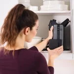 Woman putting away the Braun MultiGrill appliance.