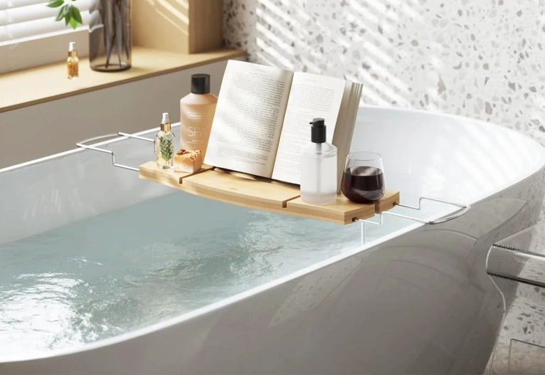 Aquala natural bath tub caddy on a white bath.