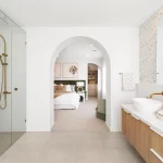 Metricon bathroom with arched walkway.
