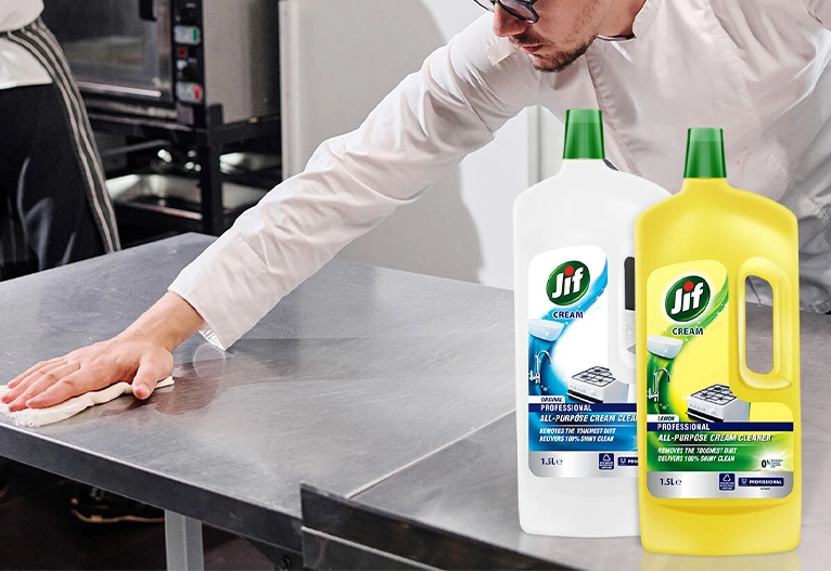 Professional cool using Jif Cream Cleaner on a stainless steel bench.